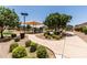 Well-maintained community playground featuring a shaded play area, benches, and a sidewalk at 2177 W Agrarian Hills Dr, San Tan Valley, AZ 85144