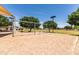 Community playground with swings and shade providing a comfortable space for recreation at 2177 W Agrarian Hills Dr, San Tan Valley, AZ 85144
