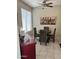 Inviting dining area features a modern light fixture, neutral paint, and decorative wall art at 2461 W Muirfield Dr, Anthem, AZ 85086