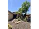 Attractive desert landscaping with a brick walkway leads to the front door of this inviting home at 2461 W Muirfield Dr, Anthem, AZ 85086