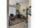 Comfortable home office with a ceiling fan and a large window providing natural light at 2461 W Muirfield Dr, Anthem, AZ 85086