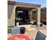 Covered patio with tile flooring and sliding glass doors for indoor/outdoor living at 2461 W Muirfield Dr, Anthem, AZ 85086