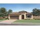 Charming single-story home featuring a tile roof, stucco siding, and a two-car garage at 25140 N 174Th Ave, Surprise, AZ 85387