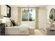 Spacious main bedroom with a large window, a comfortable bed, and tasteful furnishings at 25140 N 174Th Ave, Surprise, AZ 85387
