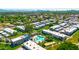 Aerial view showing community amenities with lush greenery and mature trees, swimming pool, and buildings at 2812 E Clarendon Ave, Phoenix, AZ 85016