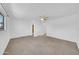 Spacious bedroom with neutral carpet, ceiling fan, large window, and ample closet space at 2812 E Clarendon Ave, Phoenix, AZ 85016