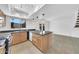 Well-lit kitchen with granite countertops, stainless steel appliances, pendant lights, and an open layout at 2812 E Clarendon Ave, Phoenix, AZ 85016