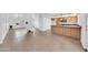 Open concept kitchen and living space featuring tiled floors, white walls and modern cabinets with a granite countertop at 2812 E Clarendon Ave, Phoenix, AZ 85016