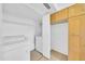 Convenient laundry area with modern washer, dryer, shelving, and storage cabinets at 2812 E Clarendon Ave, Phoenix, AZ 85016