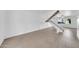 Bright living room with tiled floors and a modern white staircase leading to the upper level with lots of light at 2812 E Clarendon Ave, Phoenix, AZ 85016