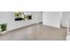 Bright living room featuring tile flooring, white walls, and a large window offering a view of the community at 2812 E Clarendon Ave, Phoenix, AZ 85016