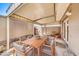 Covered patio with an outdoor dining table and seating, perfect for entertaining or relaxing at 2812 E Clarendon Ave, Phoenix, AZ 85016