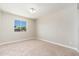 Bedroom with neutral carpet, bright window and neutral paint at 2941 W Michigan Ave, Phoenix, AZ 85053