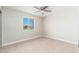 Bedroom with carpet, bright window and ceiling fan at 2941 W Michigan Ave, Phoenix, AZ 85053