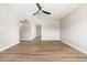 Bright and spacious bedroom featuring wood-look floors and a ceiling fan at 2941 W Michigan Ave, Phoenix, AZ 85053
