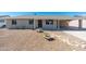 Inviting single-story home with a covered front porch, complemented by desert landscaping and rock pathway at 2941 W Michigan Ave, Phoenix, AZ 85053