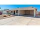 Attractive home featuring a brick facade, covered carport, and low-maintenance desert landscaping at 2941 W Michigan Ave, Phoenix, AZ 85053