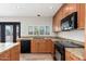Granite countertops and stainless appliances in this home's eat-in kitchen at 2941 W Michigan Ave, Phoenix, AZ 85053