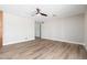 Spacious, light-filled living area with wood-look floors and a ceiling fan at 2941 W Michigan Ave, Phoenix, AZ 85053