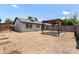 Expansive backyard featuring low-maintenance landscaping and a covered patio, perfect for entertaining and relaxation at 3039 W Ross Ave, Phoenix, AZ 85027