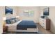 Stylishly staged bedroom featuring modern furniture, neutral decor and a window to provide natural light at 3039 W Ross Ave, Phoenix, AZ 85027