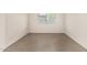 Clean and bright bedroom featuring tile flooring and a window to provide natural light at 3039 W Ross Ave, Phoenix, AZ 85027