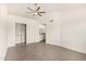 Bright bedroom with tile flooring and ceiling fan, showcasing closet and bathroom access for convenience at 3039 W Ross Ave, Phoenix, AZ 85027