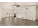 Open concept living room with tile flooring, French doors, and a modern ceiling fan at 3039 W Ross Ave, Phoenix, AZ 85027