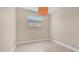 Bright bedroom with wood-look floors, large window and neutral walls at 3439 W Darien Way, Phoenix, AZ 85086