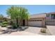 Charming single-story home featuring a tile roof, desert landscaping, and a two-car garage at 3439 W Darien Way, Phoenix, AZ 85086