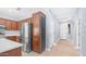 Eat in kitchen with stainless steel appliances, wood cabinets and access to the foyer at 3439 W Darien Way, Phoenix, AZ 85086