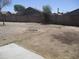 Spacious backyard with a designated fire pit area and gravel landscaping, ideal for outdoor gatherings at 40504 N Las Praderas St, San Tan Valley, AZ 85140