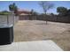 Expansive backyard with gravel, including space for landscaping and an air conditioning unit at 40504 N Las Praderas St, San Tan Valley, AZ 85140
