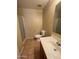 Tiled bathroom featuring a glass-enclosed shower and a single vanity with a modern sink at 40504 N Las Praderas St, San Tan Valley, AZ 85140