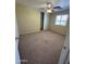 Carpeted bedroom featuring a ceiling fan, window, and closet at 40504 N Las Praderas St, San Tan Valley, AZ 85140