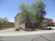 Two-story home featuring a well-kept yard with mature trees providing shade at 40504 N Las Praderas St, San Tan Valley, AZ 85140
