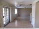 An airy living room offering multiple ceiling fans and sliding glass doors at 40504 N Las Praderas St, San Tan Valley, AZ 85140