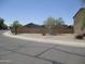 A view of the property from across the street showing desert landscaping at 40504 N Las Praderas St, San Tan Valley, AZ 85140