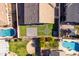 An aerial view showing a rectangular backyard with astroturf, pavers, and block wall at 4140 E Claxton Ave, Gilbert, AZ 85297