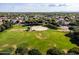 Expansive green park with a basketball court surrounded by mature trees and lush grass at 4140 E Claxton Ave, Gilbert, AZ 85297