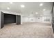 Spacious carpeted basement with multiple light fixtures and good natural light at 4140 E Claxton Ave, Gilbert, AZ 85297