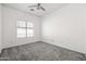 Comfortable bedroom featuring plush carpet and a bright window at 4140 E Claxton Ave, Gilbert, AZ 85297