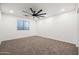 Neutral bedroom features plush carpeting, recessed lighting, and a ceiling fan for added comfort at 4140 E Claxton Ave, Gilbert, AZ 85297