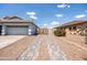 Paved driveway and gated access to the home's backyard at 4140 E Claxton Ave, Gilbert, AZ 85297