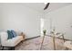 Cozy home office featuring a modern armchair and a glass desk at 4140 E Claxton Ave, Gilbert, AZ 85297