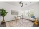 Bright home office with modern glass desk and comfortable seating at 4140 E Claxton Ave, Gilbert, AZ 85297