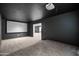 Finished home theater with projector, black paint, and large screen for movie nights and relaxing entertainment at 4140 E Claxton Ave, Gilbert, AZ 85297