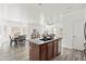 Bright, open kitchen with stainless appliances, wood cabinetry, granite countertops, and an open concept design at 4140 E Claxton Ave, Gilbert, AZ 85297