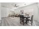 Open living space with modern decor, ceiling fan, and dining area at 4140 E Claxton Ave, Gilbert, AZ 85297