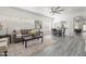 Bright living room featuring a gray sofa, modern decor, and stylish flooring at 4140 E Claxton Ave, Gilbert, AZ 85297